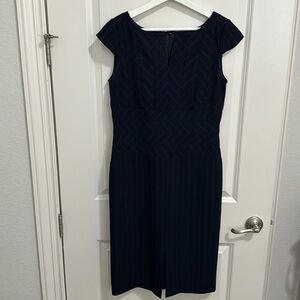 Oue Per Oue veste cap sleeve dress. Size 6. Navy with aqua blue stripes.